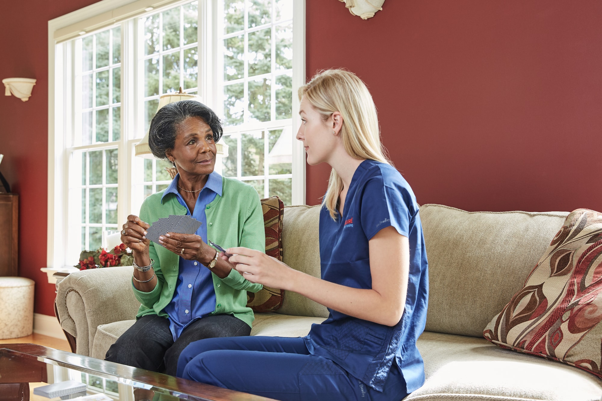 Accucare nurse playing cards with a home healthcare patient