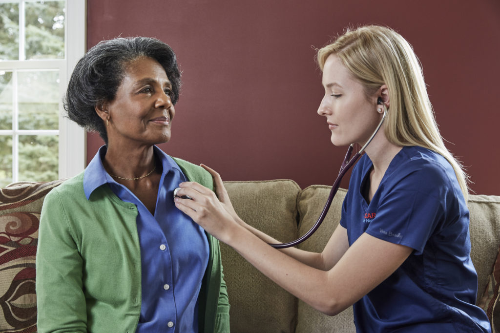 accucare caregiver checking client's vitals